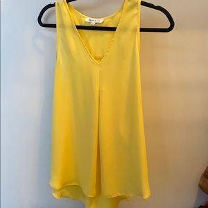 Yellow high-low blouse.